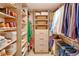 Custom walk-in closet features built-in shelving, drawers, and ample hanging space at 1551 Larimer St # 1901, Denver, CO 80202