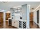 Entertainer's wet bar includes wine storage, custom cabinetry, and stylish design at 1551 Larimer St # 1901, Denver, CO 80202