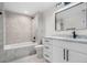 Bathroom with a marble vanity, black fixtures, and a tiled shower/tub combo at 2665 Juilliard St, Boulder, CO 80305