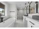 Elegant bathroom with freestanding tub, glass-enclosed shower, and modern vanities for a spa-like experience at 2665 Juilliard St, Boulder, CO 80305