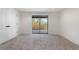 Bedroom featuring fresh paint, new carpet, and a sliding glass door to the exterior at 2665 Juilliard St, Boulder, CO 80305