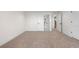 Bedroom featuring fresh paint, new carpet, and access to a bathroom at 2665 Juilliard St, Boulder, CO 80305
