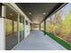 Long covered patio with concrete flooring provides ample space for outdoor relaxation and entertaining at 2665 Juilliard St, Boulder, CO 80305