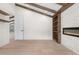 Bright living room featuring vaulted ceilings, wooden beams, built-in shelves, and a modern fireplace at 2665 Juilliard St, Boulder, CO 80305