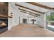 Inviting living room featuring vaulted ceilings, exposed beams, and a seamless transition to the modern kitchen at 2665 Juilliard St, Boulder, CO 80305