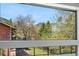 Breathtaking window view of lush greenery and majestic mountains, bringing nature indoors at 2665 Juilliard St, Boulder, CO 80305