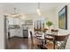 Modern kitchen with white cabinets and stainless steel appliances at 8845 Jackdaw St, Littleton, CO 80126