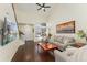 Open concept living room with hardwood floors and high ceilings at 8845 Jackdaw St, Littleton, CO 80126