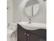 Bathroom featuring updated vanity, brushed nickel faucet, integrated lighting and a tub/shower combo at 868 S Reed Ct # H, Lakewood, CO 80226