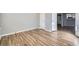 Clean bedroom featuring wood-look floors and fresh paint, ready for personal touches at 868 S Reed Ct # H, Lakewood, CO 80226