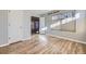 Bright bedroom with wood-look floors and large windows offering natural light at 868 S Reed Ct # H, Lakewood, CO 80226