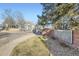 Inviting entrance to 'The Cape' community with a brick sign and well-maintained landscaping on a sunny day at 868 S Reed Ct # H, Lakewood, CO 80226