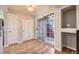 Dining area featuring sliding glass doors to the patio, hardwood floors, and modern lighting at 868 S Reed Ct # H, Lakewood, CO 80226