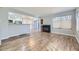 Open concept living area with a cozy fireplace and sliding door to the back patio at 868 S Reed Ct # H, Lakewood, CO 80226