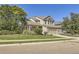 Charming two-story home with a well-manicured lawn and an attached garage at 124 Northrup Dr, Erie, CO 80516