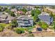 Well-maintained backyard with multiple decks, a trampoline, lush greenery and beautiful views, perfect for outdoor living at 10520 W Vassar Dr, Lakewood, CO 80227