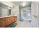 Bathroom with a vanity, shower, and nautical themed decor at 10520 W Vassar Dr, Lakewood, CO 80227