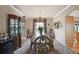 Elegant dining room features a large wooden table, ornate chairs, and a decorative china cabinet at 10520 W Vassar Dr, Lakewood, CO 80227