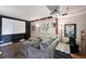 Cozy home theater with large screen, comfortable seating, and unique movie-themed decor at 10520 W Vassar Dr, Lakewood, CO 80227