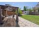 A well-maintained backyard with a gazebo, shed, and lush green lawn at 4740 W Wyoming Pl, Denver, CO 80219