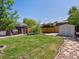 Expansive backyard featuring a patio, gazebo, shed, and well-manicured lawn at 4740 W Wyoming Pl, Denver, CO 80219