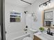 Updated bathroom with subway tile, modern fixtures, and natural light at 4740 W Wyoming Pl, Denver, CO 80219