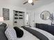 Inviting bedroom with black and white décor, closet access, and calming natural light at 4740 W Wyoming Pl, Denver, CO 80219