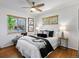 Bright bedroom with two windows, modern decor, and plush bedding at 4740 W Wyoming Pl, Denver, CO 80219