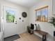 Well-lit mud room with bench seating, and view of the backyard at 4740 W Wyoming Pl, Denver, CO 80219