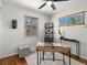 Inviting home office featuring natural light, hardwood floors, and a functional work space at 4740 W Wyoming Pl, Denver, CO 80219