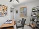 Inviting office space with built-in shelving, comfortable seating, and ample natural light at 4740 W Wyoming Pl, Denver, CO 80219