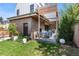 Beautiful backyard featuring a cozy outdoor patio with fireplace and lush landscaping at 501 S Race St, Denver, CO 80209