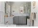 Beautiful bathroom with dual sinks, sleek cabinetry, and stylish marble tile accents at 501 S Race St, Denver, CO 80209