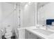Modern bathroom with a glass shower, white subway tile, and clean, sleek design at 501 S Race St, Denver, CO 80209