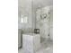 Modern bathroom with a glass-enclosed shower, marble tile, and stylish fixtures at 501 S Race St, Denver, CO 80209