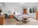Cozy bedroom with natural light, a comfortable bed, and wood furnishings at 501 S Race St, Denver, CO 80209