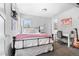 Cozy bedroom featuring a metal frame bed, plush bedding, and a bright, airy feel at 501 S Race St, Denver, CO 80209
