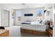 Comfortable bedroom with two windows, natural light and a wooden bed frame at 501 S Race St, Denver, CO 80209