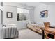 Shared bedroom featuring two twin beds, a side table, and a window at 501 S Race St, Denver, CO 80209