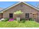 Charming brick home with a well-kept lawn and garden featuring decorative landscaping at 501 S Race St, Denver, CO 80209