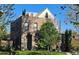 Stunning exterior of a brick home with a rooftop terrace and mature trees at 501 S Race St, Denver, CO 80209