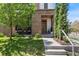 Charming front entrance with a modern door and well-manicured lawn at 501 S Race St, Denver, CO 80209