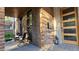 Inviting front porch with brick accents and cozy seating area at 501 S Race St, Denver, CO 80209