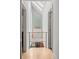 Upstairs hallway featuring light wood floors, minimalist design, and abundant natural light at 501 S Race St, Denver, CO 80209