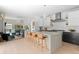 Open-concept kitchen featuring a large marble island with seating and modern appliances at 501 S Race St, Denver, CO 80209