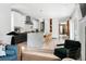 Open floor plan with kitchen island, seating, modern appliances, and easy living concept at 501 S Race St, Denver, CO 80209