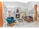 Bright living room featuring a fireplace, modern staircase, and stylish furnishings at 501 S Race St, Denver, CO 80209