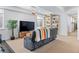 Inviting living room featuring a large tv, comfortable seating, and built-in shelving at 501 S Race St, Denver, CO 80209