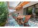 Inviting outdoor patio with a dining table, seating area, fireplace and elegant pergola at 501 S Race St, Denver, CO 80209