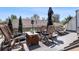 Enjoy this rooftop deck with comfortable seating, an umbrella, and neighborhood views at 501 S Race St, Denver, CO 80209